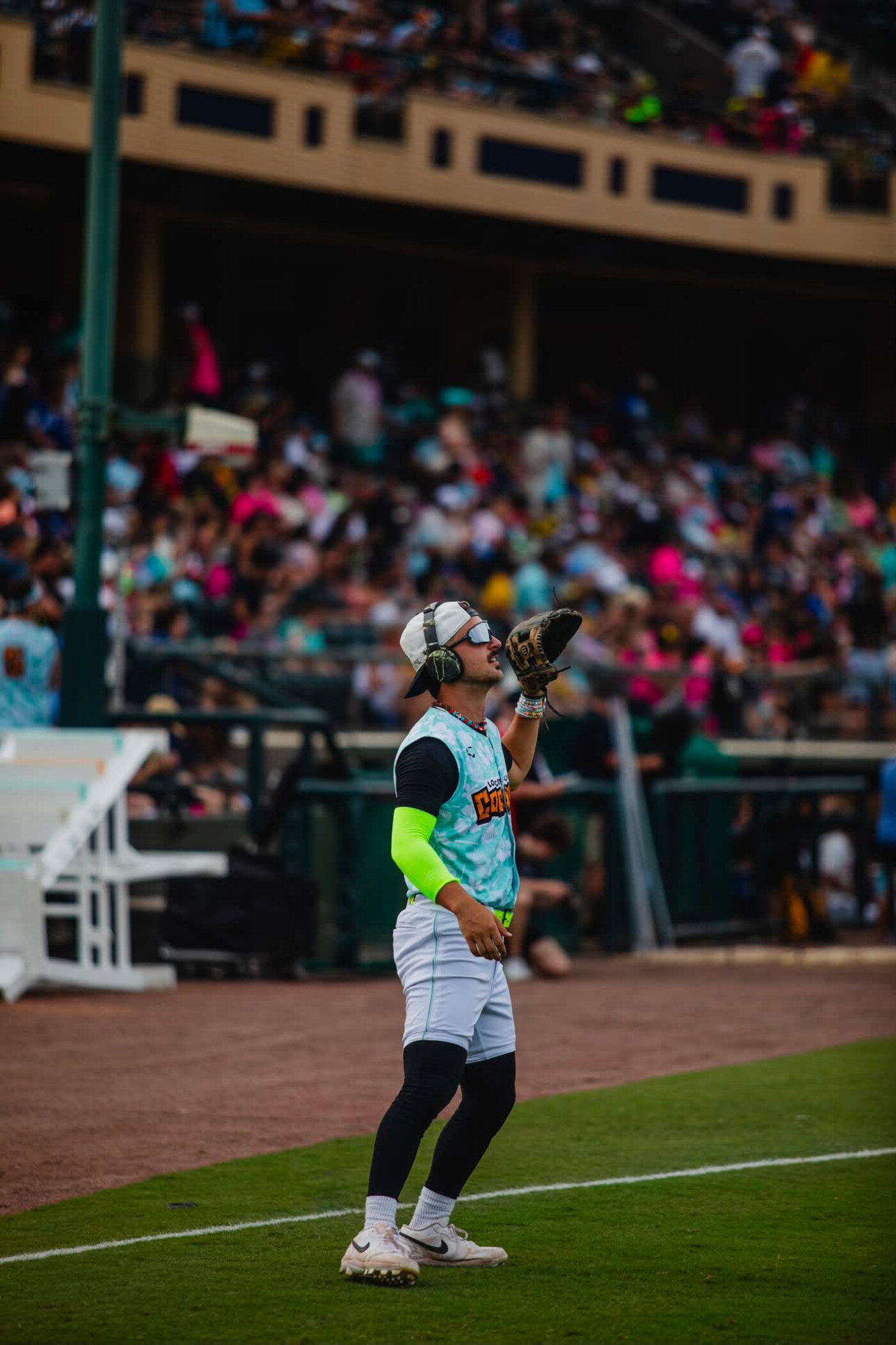 Squintz on the field — outfielder tracking a fly ball